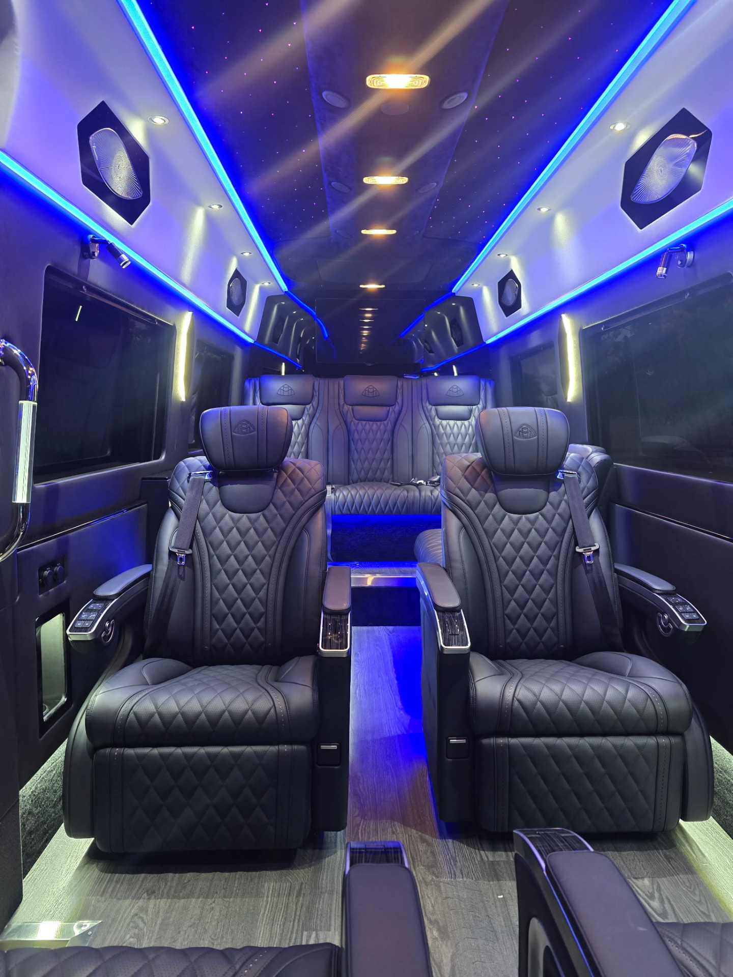 Luxury Sprinter interior with Maybach-style captain's chairs and starlight ceiling